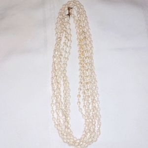 Vintage unsigned white plastic rice beads necklace four strand